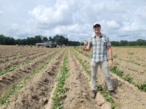 Enrique Pena Martinez in a sweet potato field