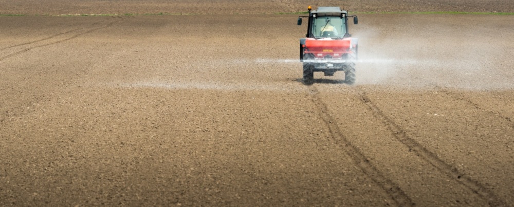 Tractor spraying fertilizer