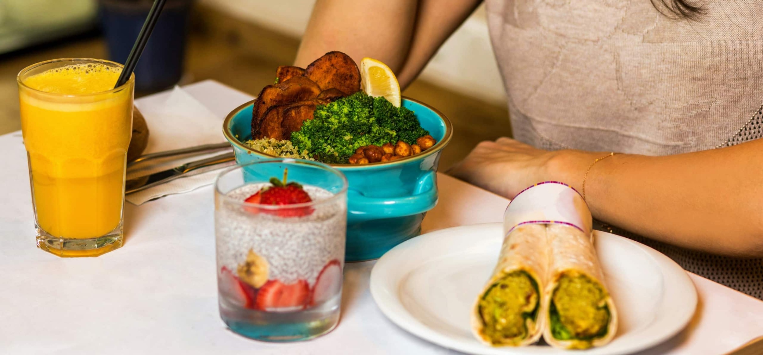 Person at a table eating a healthy lunch