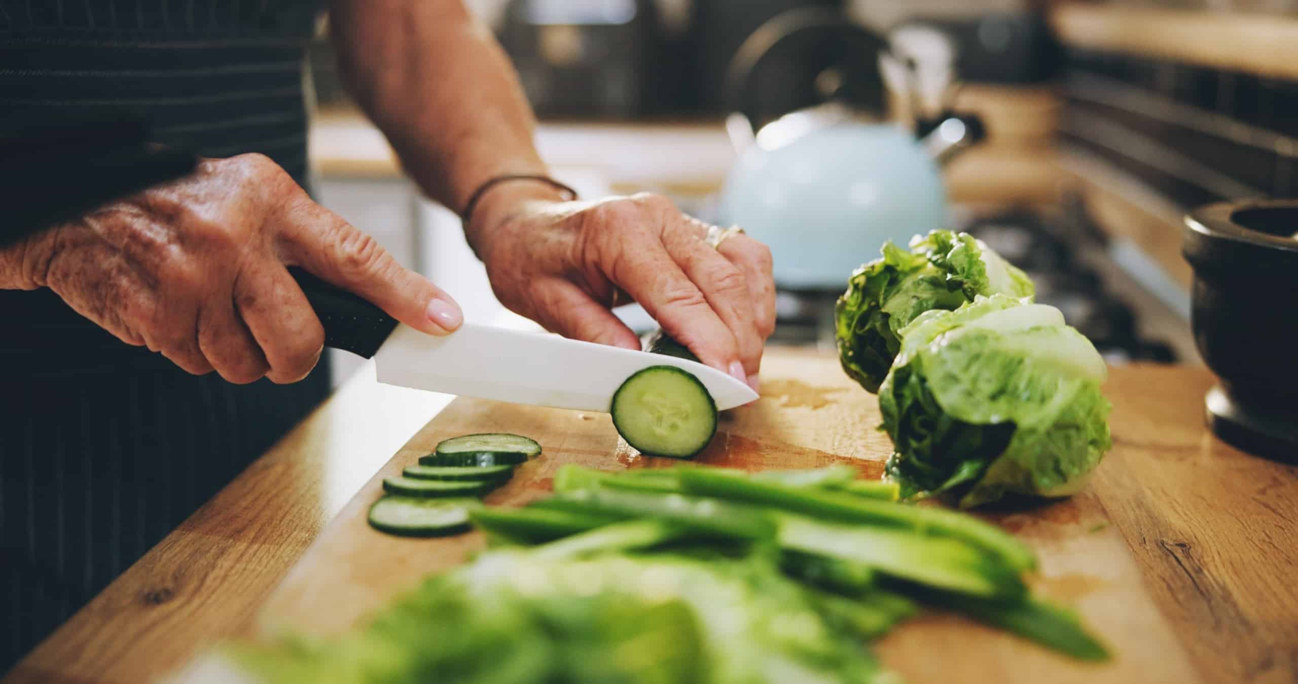 Person chopping vegetables for a healthy meal